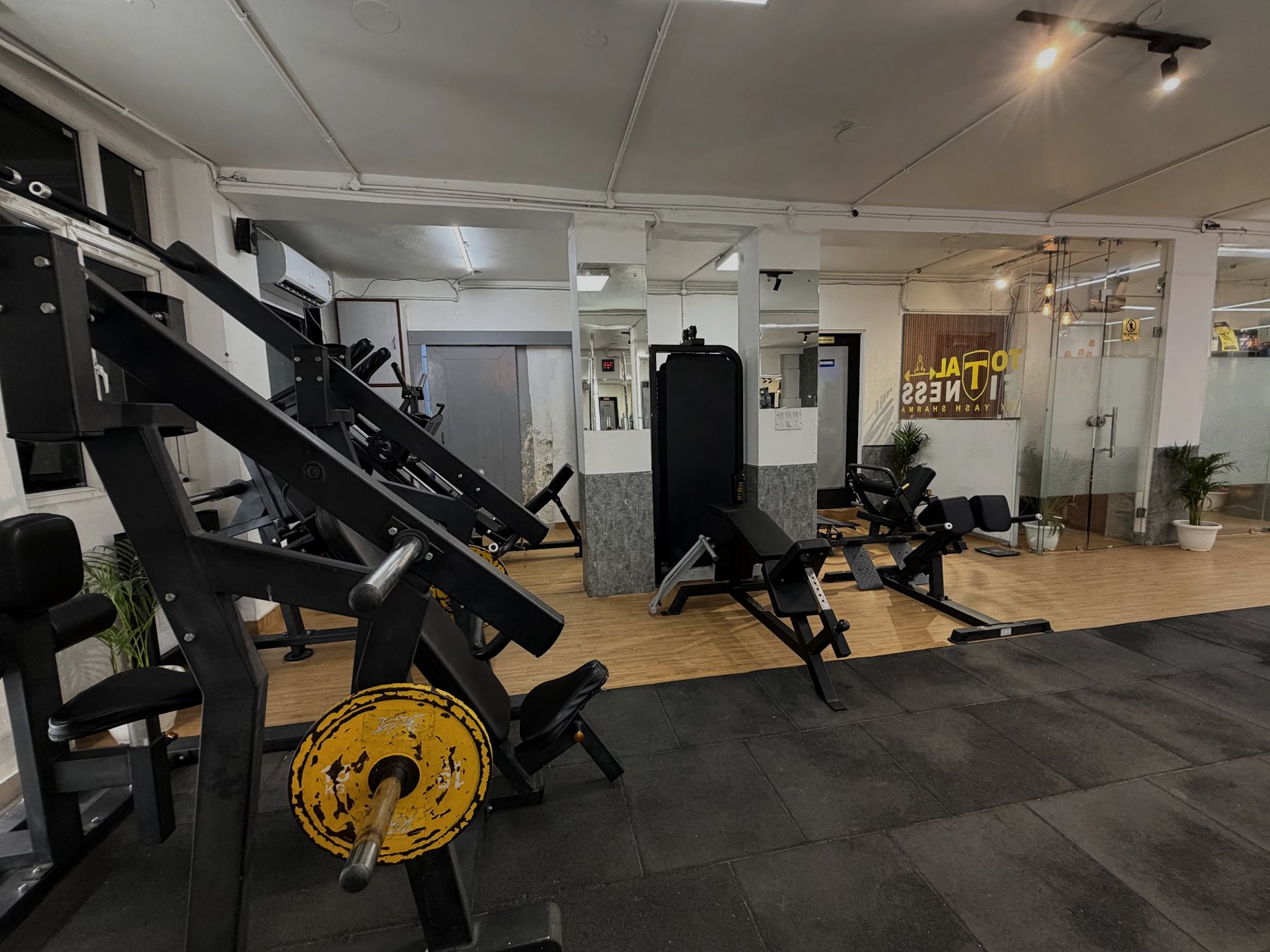 Plate-loaded strength machines at Total Fitness Kalkaji